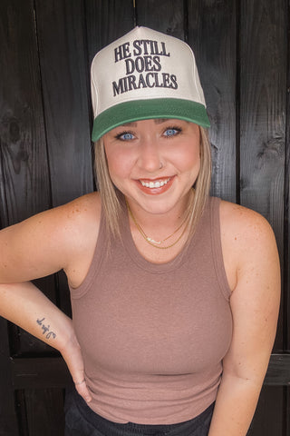 He Still Does Miracles Trucker Hat